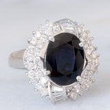 Anello a margherita vintage in platino con zaffiro (4.74ct) e diamanti (0.86ctw), anni ‘80