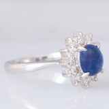 Anello a margherita vintage in platino con zaffiro (1.20ct) e diamanti (0.40ctw), anni ‘70/‘80