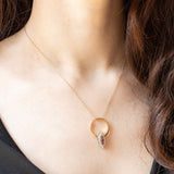 Gioiello vintage 2 in 1 e convertibile da anello a ciondolo in oro giallo e bianco 14K con rubini (0.12ctw ca.) e diamanti di taglio brillante (0.32ctw ca.), anni ‘70/‘80