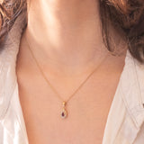 Ciondolo vintage in oro giallo 9K con rubino e diamanti di taglio brillante (0.14ctw ca.), anni ‘70/‘80