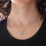 Ciondolo vintage in oro giallo e bianco 14K con topazio azzurro (2ct ca.) e diamanti (0.03ctw ca.), anni ‘70