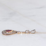Collier vintage in stile antico con catenina in oro bianco 18K e con ciondolo in oro giallo 18K e argento con rubino (0.60ct ca.) e diamante di taglio rosetta (0.10ct ca.), anni ‘50/‘60