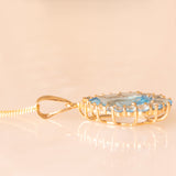 Collana vintage con catenina in oro giallo 9K e con ciondolo in oro giallo 9K con topazi azzurri (6ctw ca.), anni ‘2000