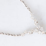 Collier vintage in oro bianco 18K con smeraldo (0.40ct ca.) e diamanti di taglio brillante (2.10ctw ca.), anni ‘80