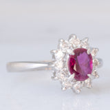 Anello a margherita vintage in platino con rubino (0.62ct) e diamanti (0.36ctw), anni ‘70/‘80
