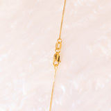 Collana vintage con catenina in oro giallo 9K e con ciondolo in oro giallo 9K con topazi azzurri (6ctw ca.), anni ‘2000