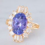 Anello ballerina vintage in oro giallo 14K con tanzanite (5.60ct ca.) e diamanti di taglio brillante e tapered (1.30ctw ca.), anni ‘80