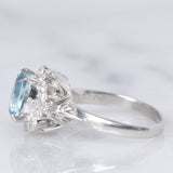 Anello a margherita vintage in platino con acquamarina (0.93ct) e diamanti (0.29ctw), anni ‘80