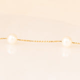 Collana vintage in oro giallo 18K con perle bianche