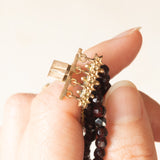 Braccialetto vintage con quattro fili di granati e con chiusura in oro giallo 14K con perline, anni ‘50/‘60