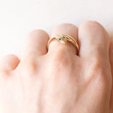 Anello a serpente vintage in oro giallo 18K con smeraldi e diamante di taglio brillante (0.02ct ca.), anni ‘70