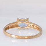 Solitario moderno in oro giallo 9K con tanzanite (0.70ct ca.) e zirconi bianchi