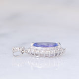 Ciondolo a margherita vintage in platino con tanzanite (0.81ct) e diamanti (0.37ctw)