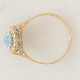 Anello a margherita vintage in oro giallo 9K con topazio azzurro (1.50ct ca.) e diamanti (0.10ctw ca.), anno 1988