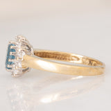 Anello a margherita vintage in oro giallo 9K con topazio azzurro (0.55ct ca.) e diamanti (0.05ctw ca.)