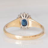 Anello a margherita vintage in oro giallo 9K con zaffiro (0.70ct ca.) e diamanti (0.08ctw ca.), anno 1991
