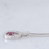 Collana vintage in platino con ciondolo con rubino (0.21ct) e diamanti di taglio brillante (0.24ctw)