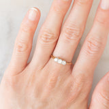 Trilogy antico in oro giallo e bianco 18K con diamanti di taglio brillante (0.40ctw ca.), anni ‘20/‘30
