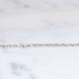 Collier vintage in oro bianco 18K con smeraldo (0.40ct ca.) e diamanti di taglio brillante (2.10ctw ca.), anni ‘80