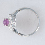 Anello a margherita vintage in platino con rubino stellato (1.35ct) e diamanti (0.66ctw ca.), anni ‘90