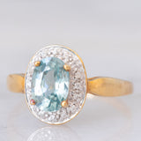 Anello a margherita in oro giallo 9K con zircone azzurro (1.83ct ca.) e zirconi bianchi