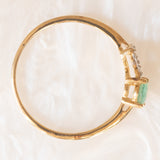 Anello in oro giallo e bianco 10K con smeraldo (0.50ct ca.) e topazi bianchi, anno 2016