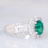 Anello a fiore vintage in platino con smeraldo (0.81ct) e diamanti (0.93ctw), anni ‘80
