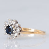 Anello a margherita vintage in oro giallo e bianco 9K con zaffiro (0.25ct ca.) e diamanti (0.10ctw ca.), anno 1981
