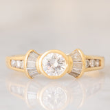 *RISERVATO* Anello “ballerina” in oro giallo 18K con diamanti di taglio brillante e di taglio tapered (0.71ctw ca.), anni ‘80