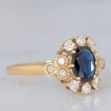 Anello a margherita vintage in oro giallo 14K con zaffiro (0.70ct ca.) e diamanti (0.20ctw ca.), anni ‘80