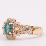 Anello a margherita vintage in oro giallo 14K con smeraldo (0.40ct ca.) e diamanti di taglio brillante (0.60ctw ca.), anni ‘70/‘80