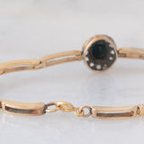 Braccialetto semirigido retrò in oro giallo 14K a argento con zaffiro (1ct ca.) e diamanti di taglio rosetta (0.36ctw ca.), anni ‘40/‘50
