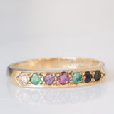 Anello “DEAREST” vintage in oro giallo 9K con diamante, smeraldi, ametista, rubino, zaffiro e tormalina, anno 1994