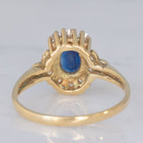 Anello a margherita vintage in oro giallo 14K con zaffiro (0.70ct ca.) e diamanti (0.20ctw ca.), anni ‘80
