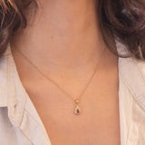 Ciondolo vintage in oro giallo 9K con rubino e diamanti di taglio brillante (0.14ctw ca.), anni ‘70/‘80