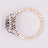 Anello a margherita vintage in oro giallo 9K con zaffiro (1.33ct ca.) e diamanti (0.12ctw ca.), anno 1985