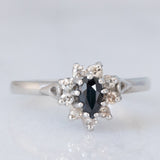 Anello a margherita vintage in platino con zaffiro (0.45ct ca.) e diamanti (0.14ctw ca.), anno 2006