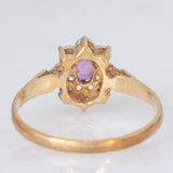 Anello a margherita vintage in oro giallo e bianco 9K con rubino (0.12ct ca.) e diamanti (0.04ctw ca.), anno 1988