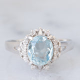 Anello a margherita vintage in platino con acquamarina (1.09ct) e diamanti (0.10ctw), anni ‘80/‘90