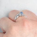 Anello a margherita vintage in platino con zaffiro stellato (0.71ct) e diamanti (0.27ctw), anni ‘80/‘90