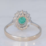 Anello a margherita vintage in oro bianco 14K con smeraldo (0.40ct ca.) e diamanti di taglio brillante (0.20ctw ca.), anni ‘80