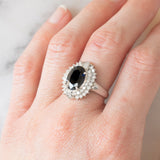 Anello a margherita vintage in platino con zaffiro (4.74ct) e diamanti (0.86ctw), anni ‘80