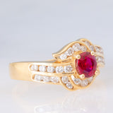 Anello a margherita vintage in oro giallo 18K con rubino (0.51ct) e diamanti (0.41ctw), anni ‘80/‘90