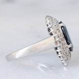 Anello a margherita vintage in platino con zaffiro (4.74ct) e diamanti (0.86ctw), anni ‘80