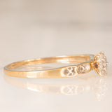 Anello a fascia con fiore centrale in oro giallo 9K con diamanti (0.05ctw ca.), anni ‘70/‘80