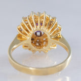 Anello a fiore vintage in oro giallo 14K con rubino (1ct ca.) e diamanti di taglio brillante (0.70ctw ca.), anni ‘70