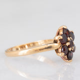 Anello a fiore vintage in oro giallo 9K con granati (0.70ctw ca.), anno 1966