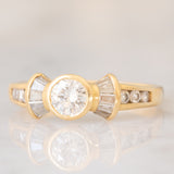 *RISERVATO* Anello “ballerina” in oro giallo 18K con diamanti di taglio brillante e di taglio tapered (0.71ctw ca.), anni ‘80