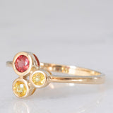 Trilogy astrattato in oro giallo 8K con topazi colorati (0.30ctw ca.), anni ‘70/‘80