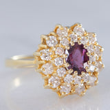 Anello a fiore vintage in oro giallo 14K con rubino (1ct ca.) e diamanti di taglio brillante (0.70ctw ca.), anni ‘70